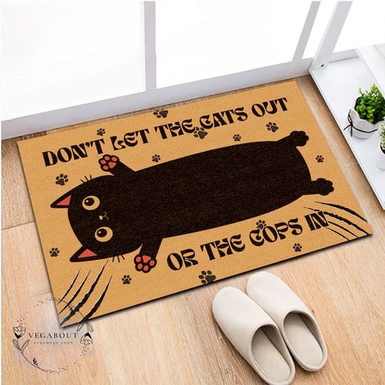 Discover Don't let the cats out or the cops in doormat, Funny black cat
