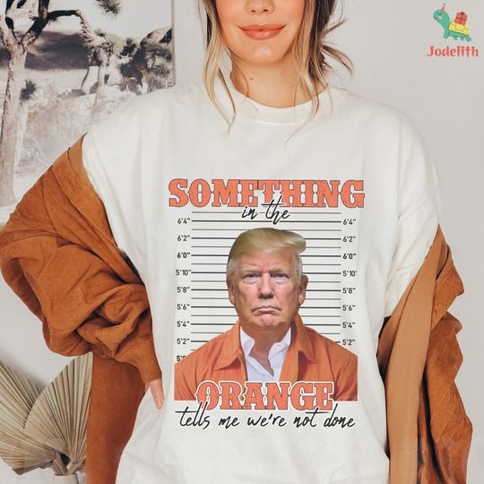 Discover Trump Mugshot Something In The Orange Shirt