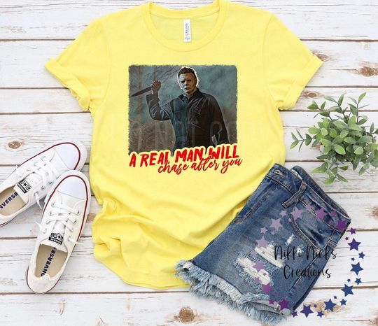 Discover A real man will will chase after you shirt, scary movies killer shirt, horror murders shirt, Halloween movie killer tee, Michael Myers shirt