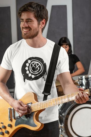 Discover B182 Smiley Splatter X Logo - Vintage Pop Punk Rock Graphic Band Tee Tour Unisex Softstyle T-Shirt Travis Barker