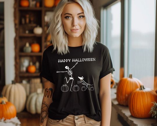Discover Cute Halloween Skeletons TShirt, Human and Pet Dog Skeletons Dancing Around Pumpkins, Trick or Treat Shirt, Spooky Season Party Tee