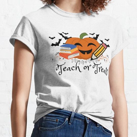 Discover Teach or treat  teacher halloween pumpkin holding books and pens costume T-shirts