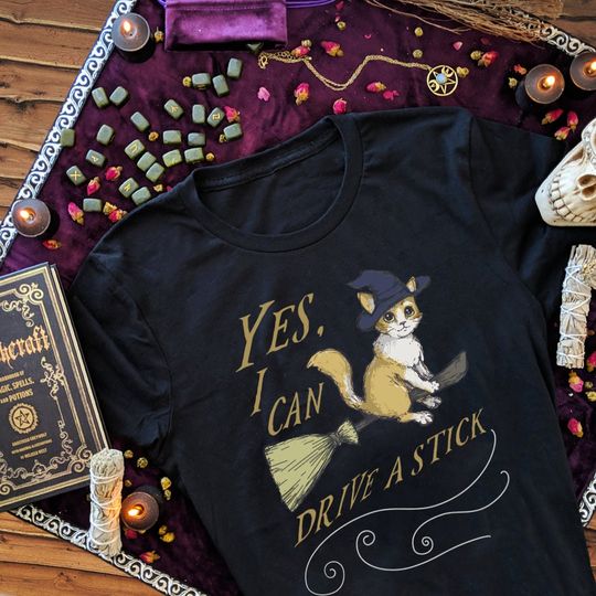 Discover Yes I Can Drive A Stick Funny Cat Shirt Women Witch Clothing Plus Size Cute Halloween Cat Lover Gift for Her Witchcraft Gifts for Witches