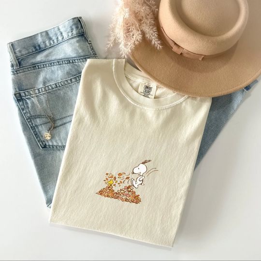 Discover Snoopy Leaf Pile Graphic Tee