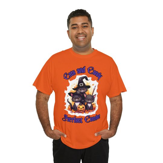 Discover Trio of Whiskered Witches: Cats, Candy, and Endearing Charm Unisex Heavy Cotton Tee