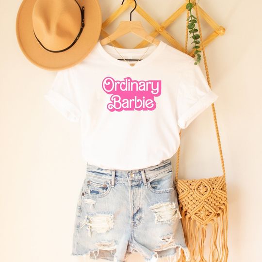Discover Ordinary Barbie Unisex T-shirt Jersey Short Sleeve Tee in White and Barbie Pink