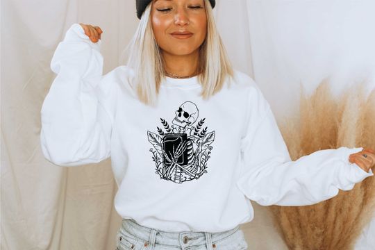 Discover Adult Skeleton Holding Book Sweatshirt