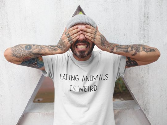 Discover Eating Animals Is Weird Funny Vegan T-Shirt
