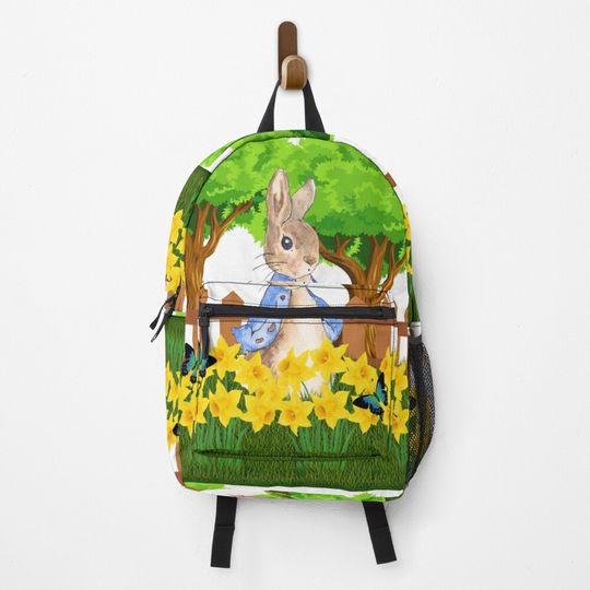 Discover Peter rabbit in a daffodil field Backpack