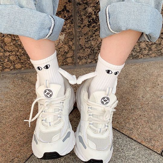 Discover Eyes hold hands sock, perfect for quirky couples, with magnetic hands