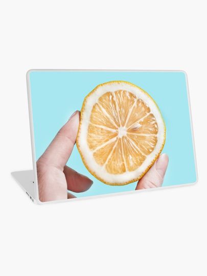 Discover Juicy lemon on a blue background | Laptop Skin
