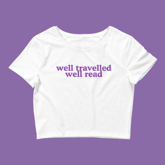 Discover well travelled well read baby tee | available in black and white