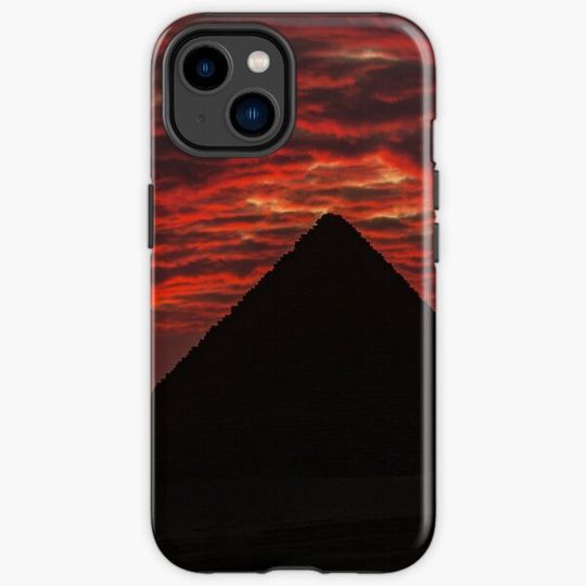 Discover Dramatic sunset behind one of the 3 great Pyramids in Cairo - Egypt