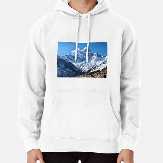 Discover A snowy mountain range with blue sky