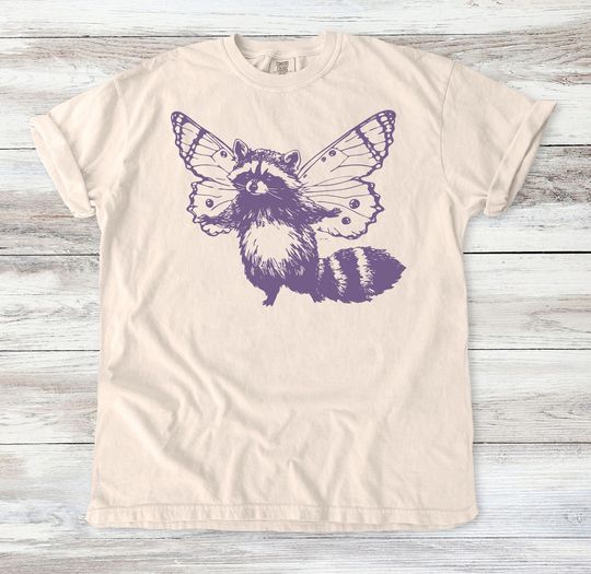 Discover Fantasy Raccoon with Butterfly Wings T-Shirt - Whimsical Animal Graphic Tee - Unique Nature