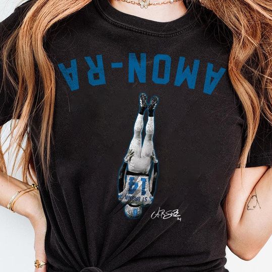 Discover Amon-Ra St Brown Head Stand Unisex Softstyle T-Shirt