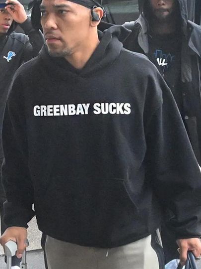 Discover Amon-Ra St. Brown Wearing Green Bay Sucks Hoodie