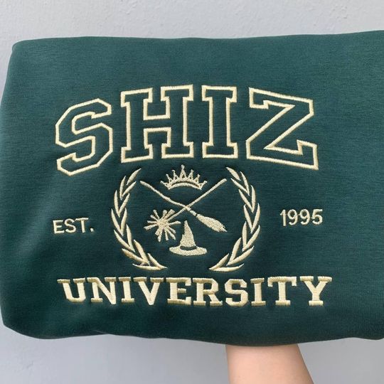 Discover Embroidered Shiz University Shirt, Changed For Good Shirt, Defy Gravity Broomstick Magic Wand Shirt