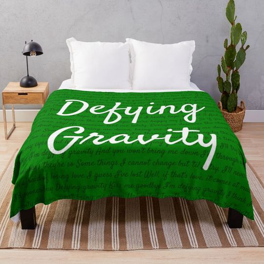 Discover Defying gravity Throw Blanket