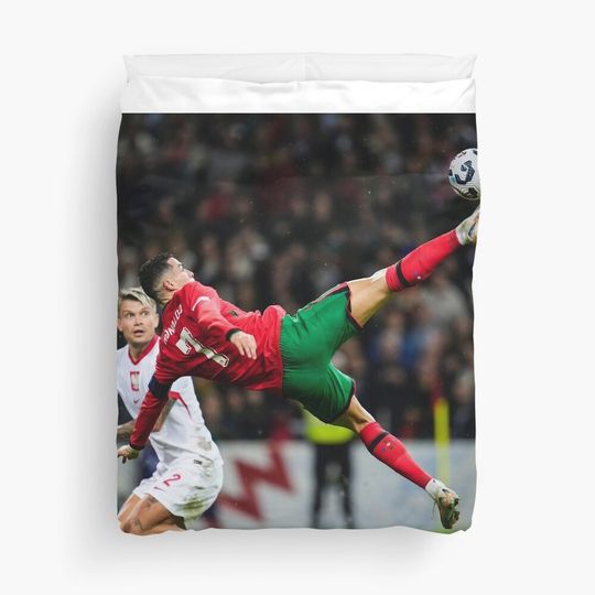 Discover Cristiano Ronaldo: The GOAT in Action Duvet Cover