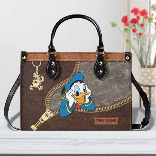 Discover Personalized Donald Duckk Women PU Leather Handbag, Cartoon Bag, Couple Gift
