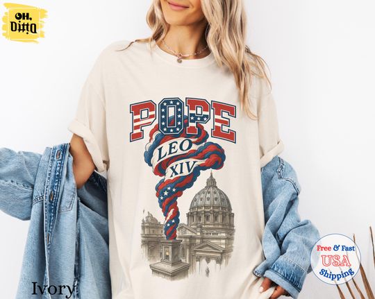 Discover Pope Leo XIV Shirt, First American Pope Tee, USA Flag Smoke Vatican Graphic Shirt