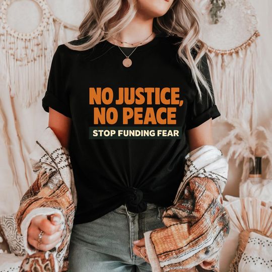 Discover No Justice No Peace Shirt Unisex Graphic Tee with Stop Funding Fear Slogan | Activist Protest T-Shirt