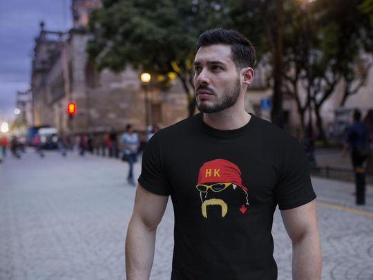 Discover Hulk Tribute Tee- Retro Graphic Shirt Honoring Wrestling Legend/80s Style Vintage Vibes/Bold Red and Yellow Design