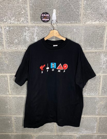 Discover Vintage 1990s Stomp Out Loud Black Graphic Music T-Shirt